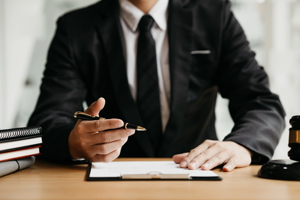 a-lawyer-sits-in-his-office-on-a-table-with-a-sma-2026-01-07-01-02-48-utc